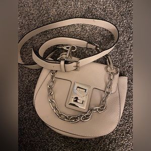 Steve Madden crossbody bag. Cream colored bag with silver hardware.